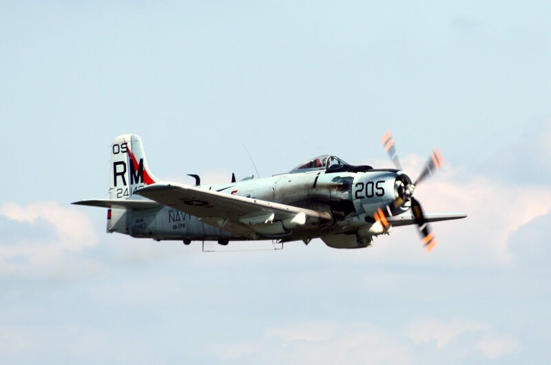 navy propeller plane in flight