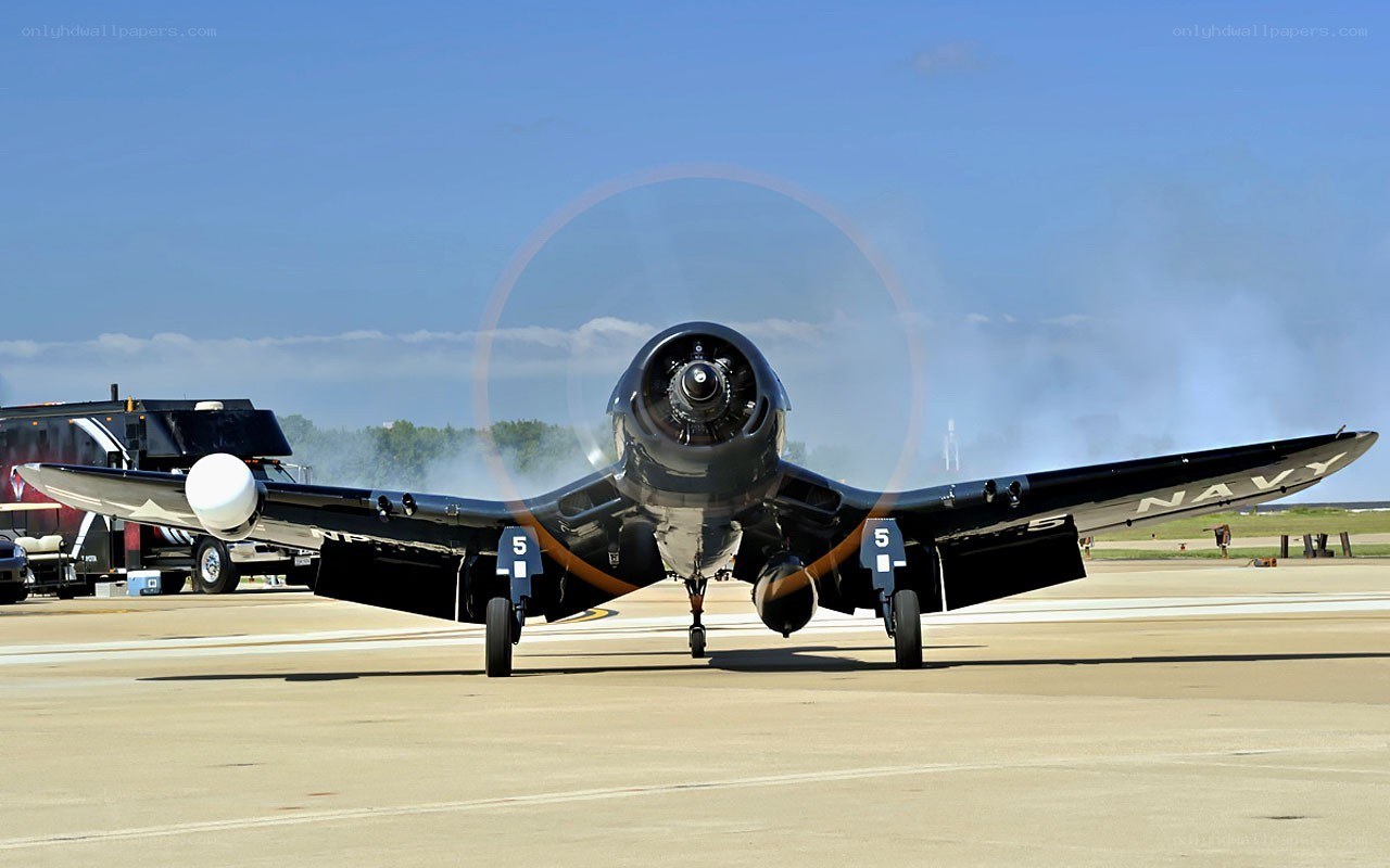 Navy propeller plane on tarmac