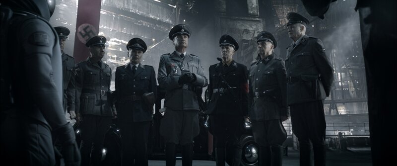Nazi officers in a factory