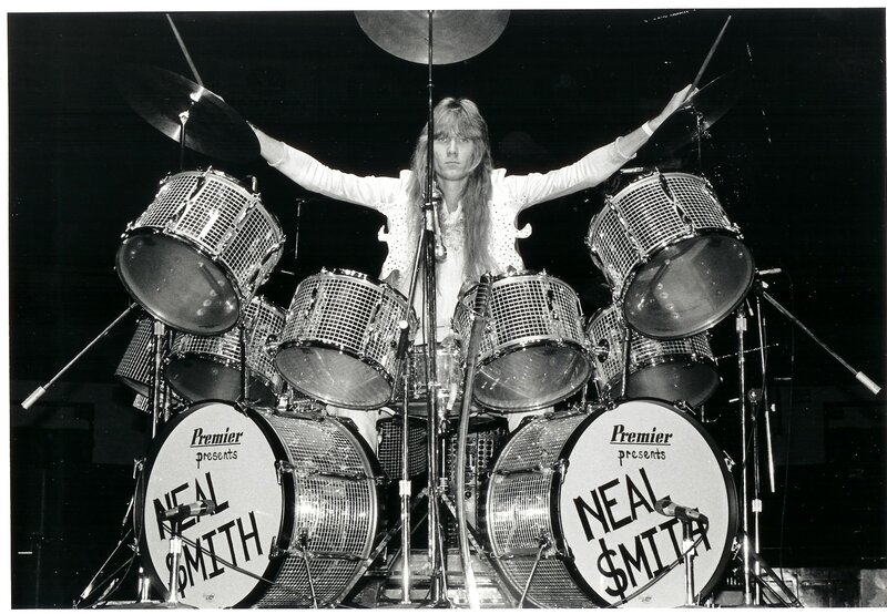Neal Smith on stage with drum kit