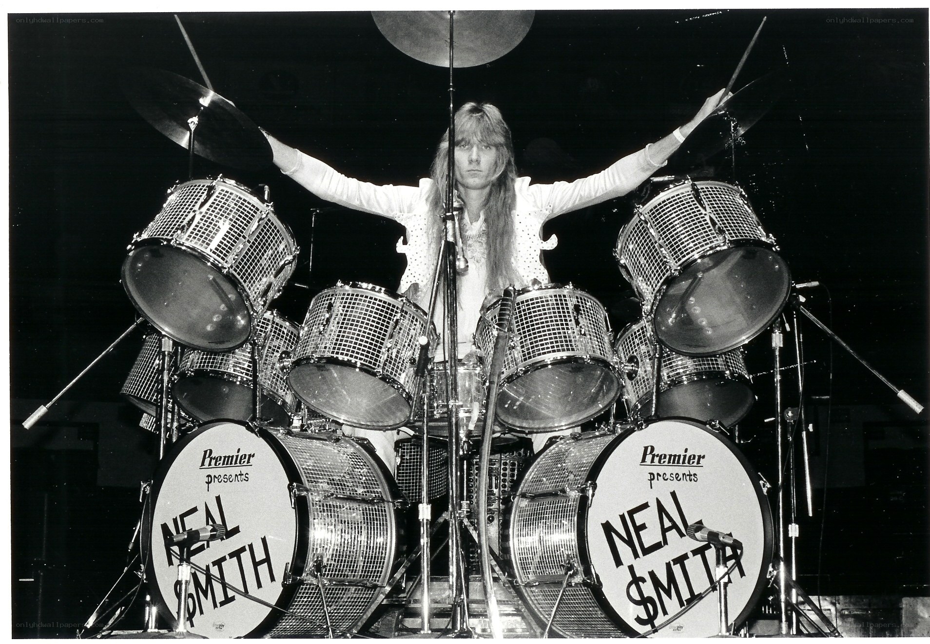 Neal Smith on stage with drum kit