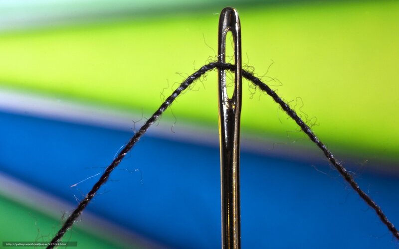 Needle with thread close-up
