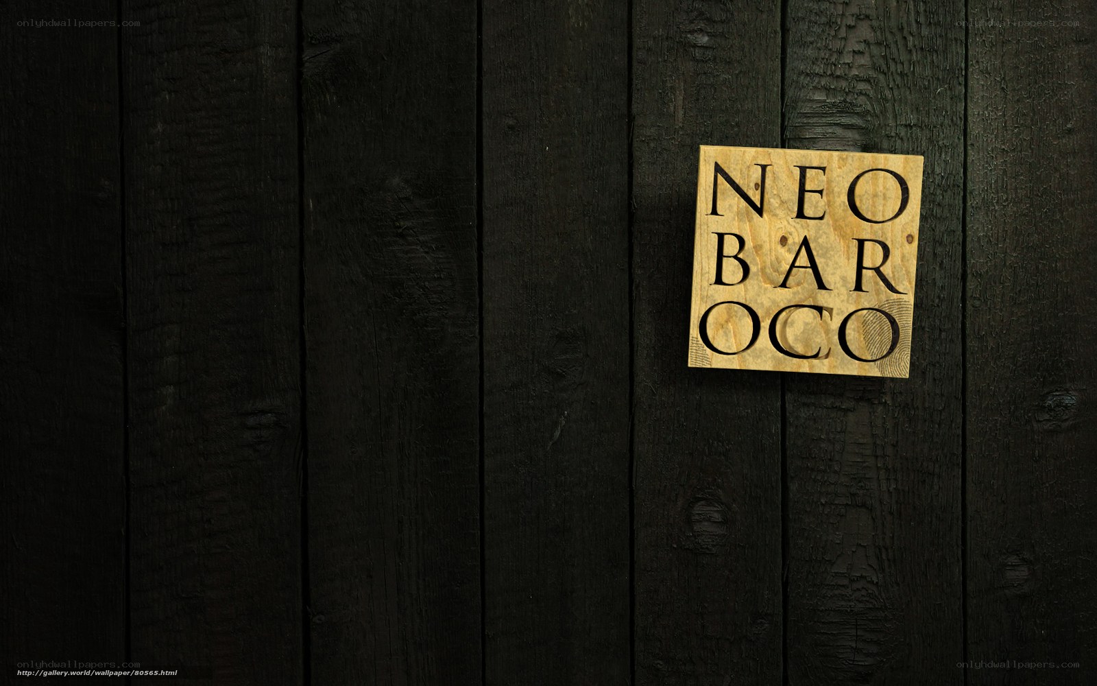 Neo Baroco sign on dark wood
