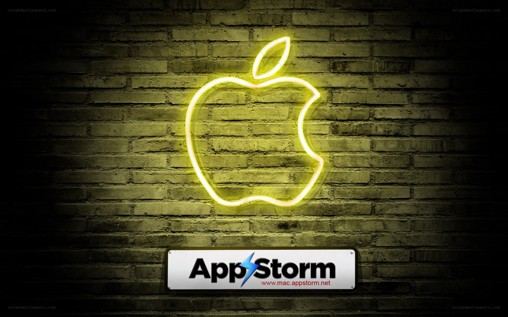 Neon Apple logo on brick wall