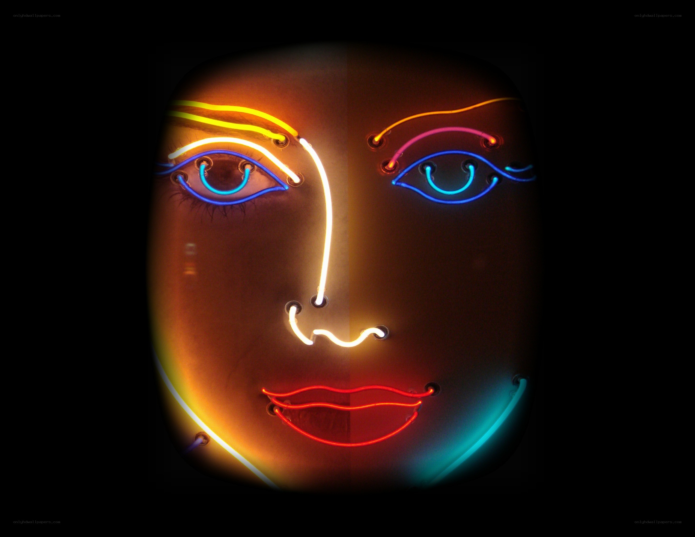 neon face art installation