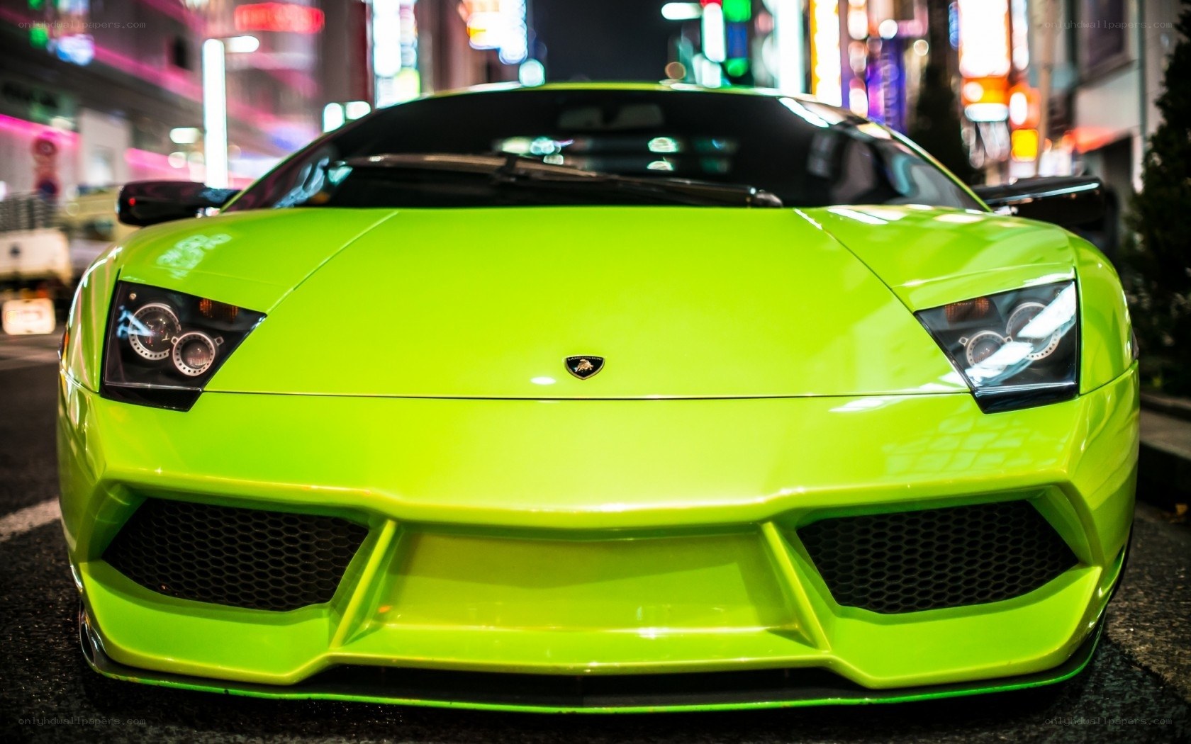 Neon green Lamborghini at night