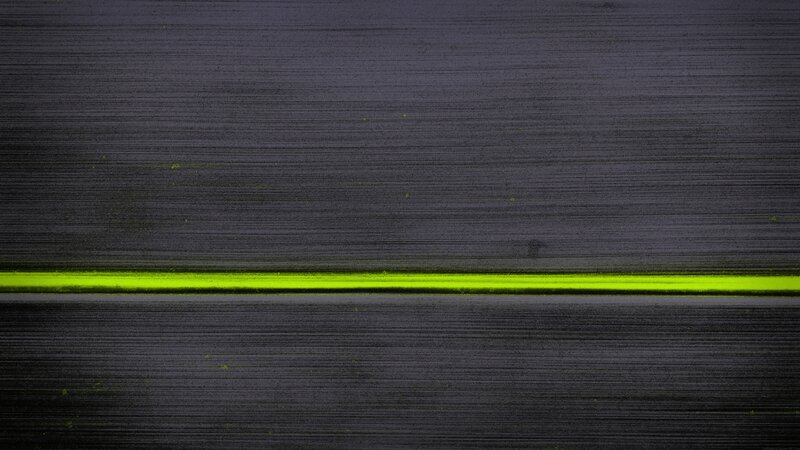 Neon Green Line on Dark Surface