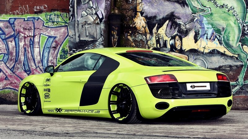 neon green sports car with graffiti