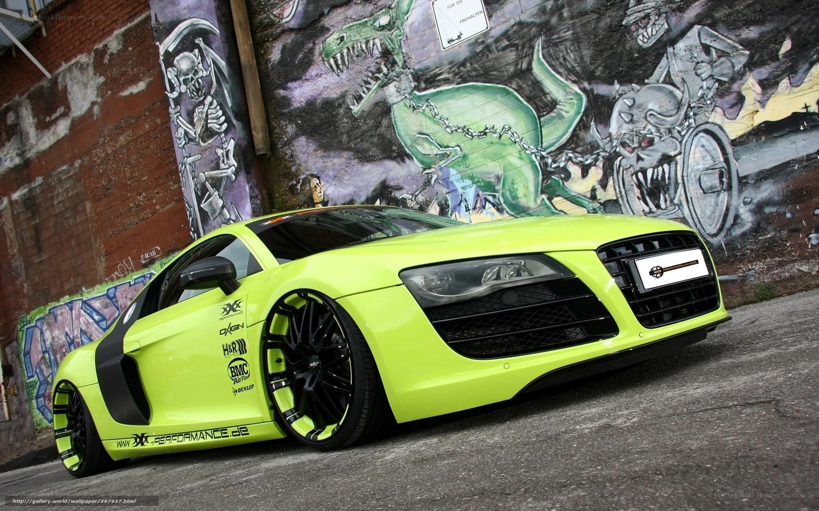 neon green sports car with graffiti