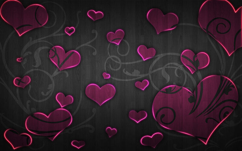 neon hearts on dark wood