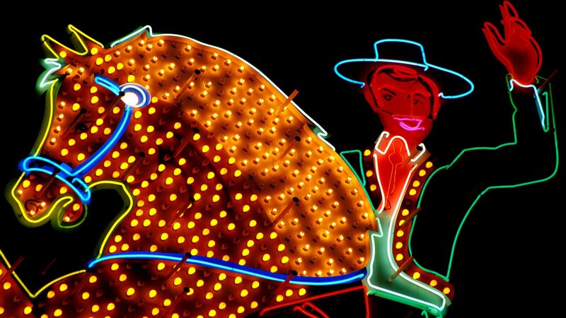 Neon horse and cowboy sign