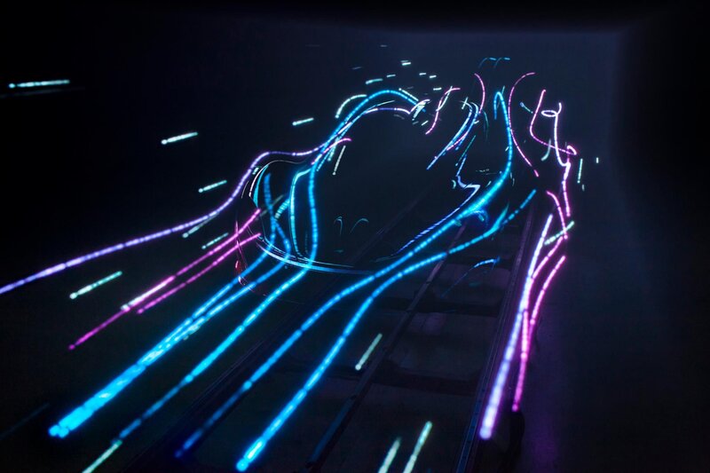 Neon light trails on a dark track
