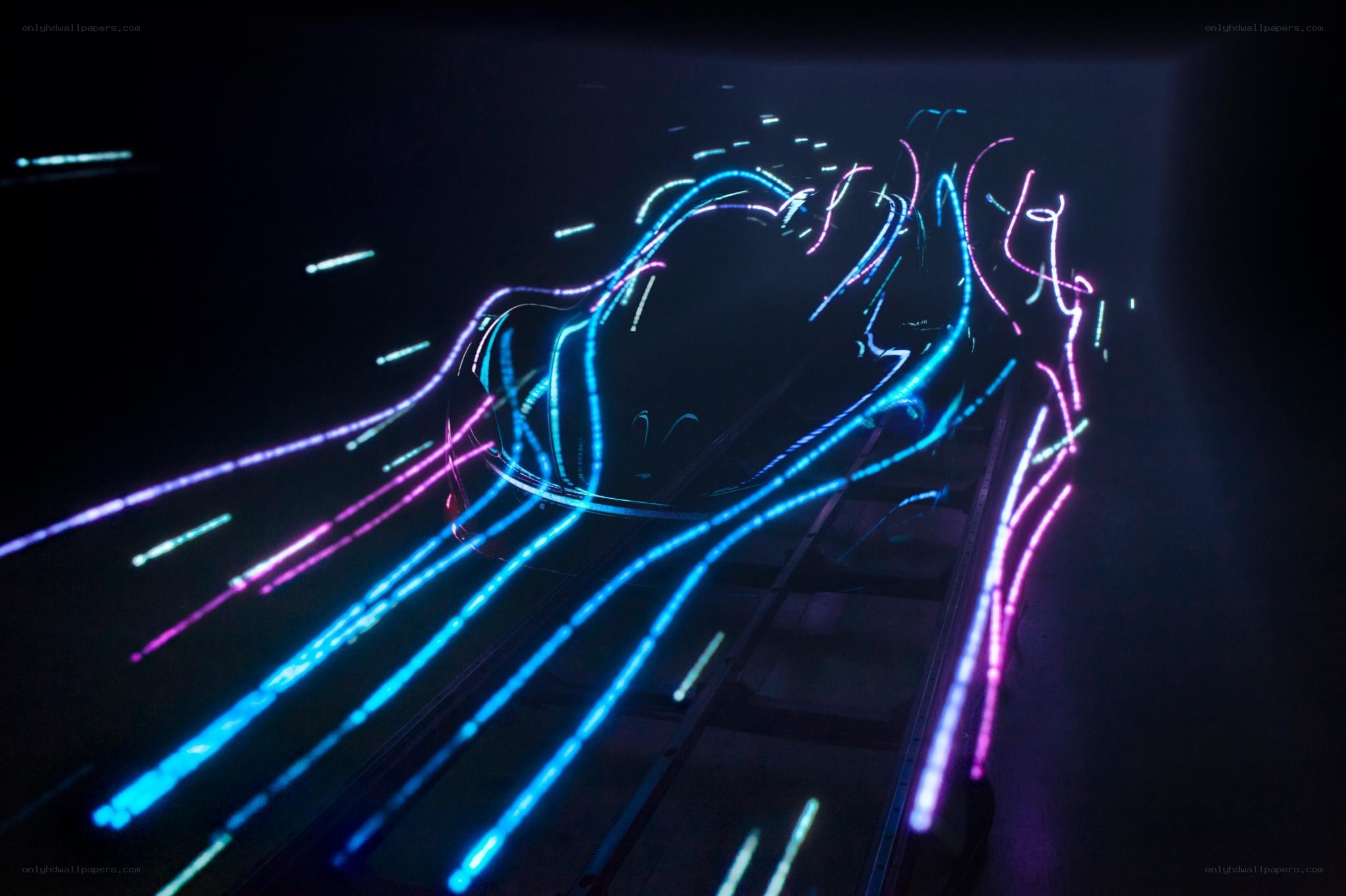 Neon light trails on a dark track