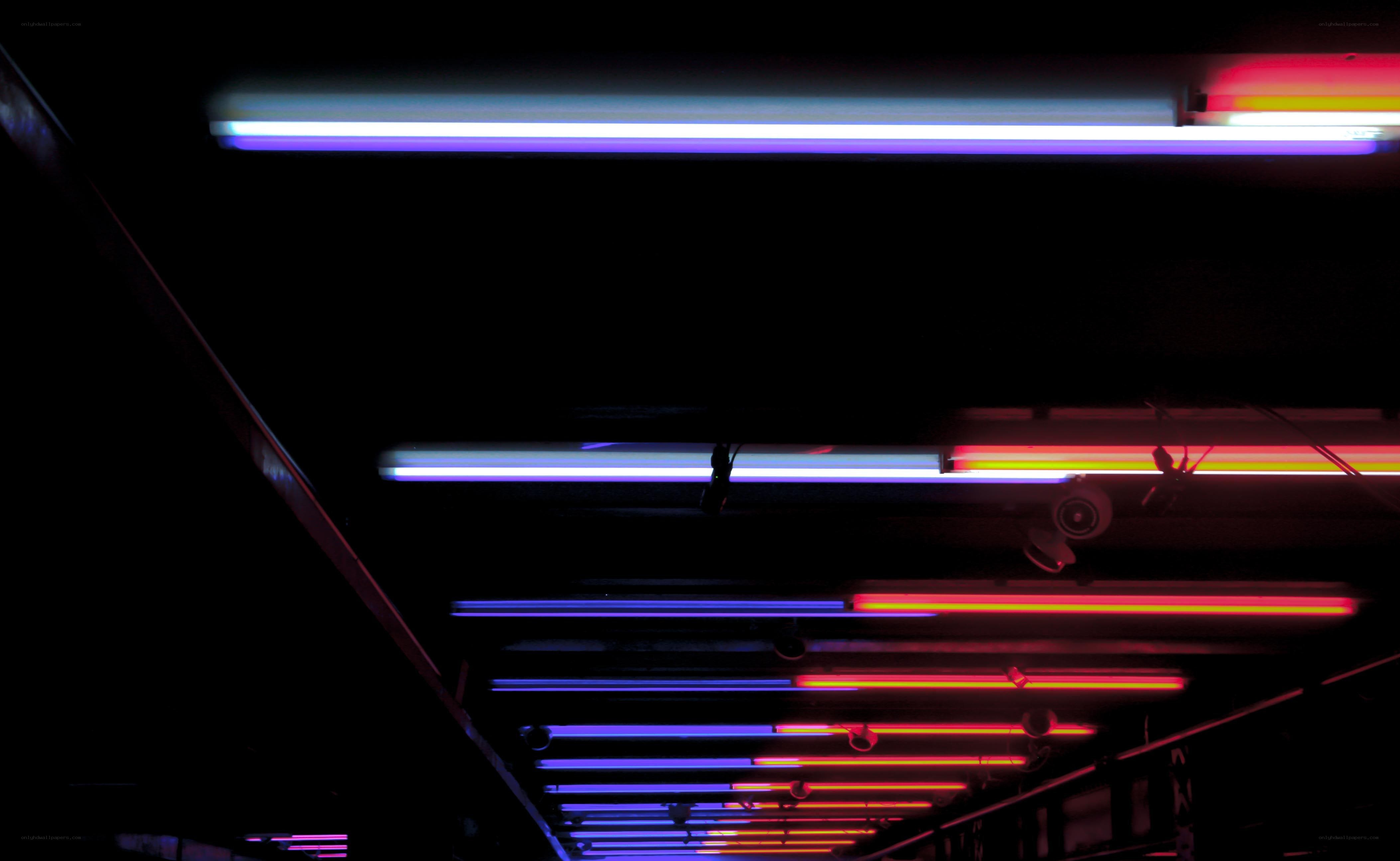 Neon lights in dark space