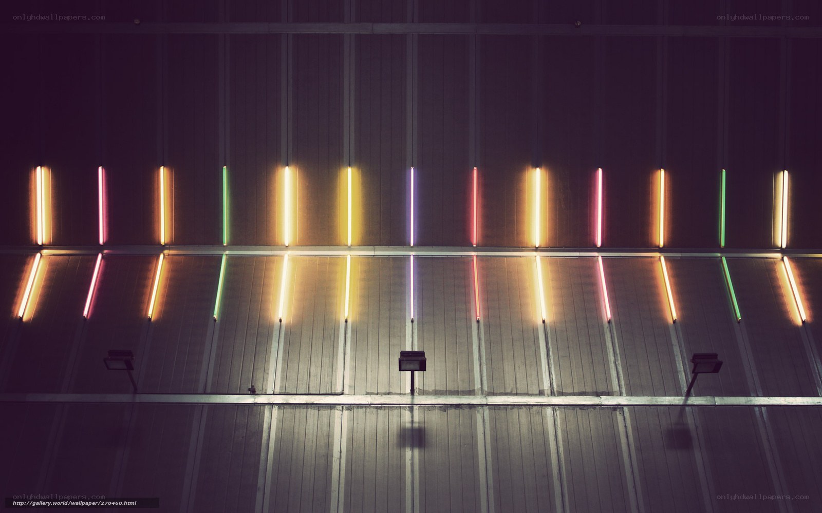 Neon lights on metal wall
