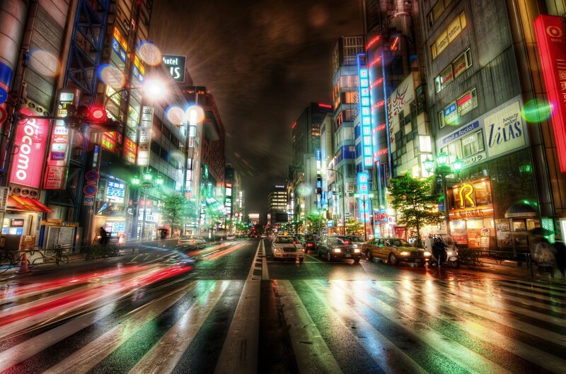 Neon-lit city street at night