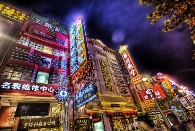 neon-lit city street at night
