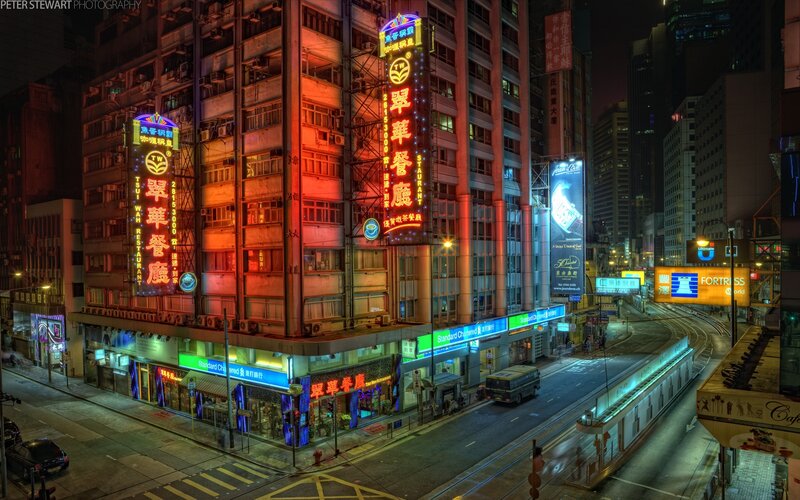 Neon-lit city street at night