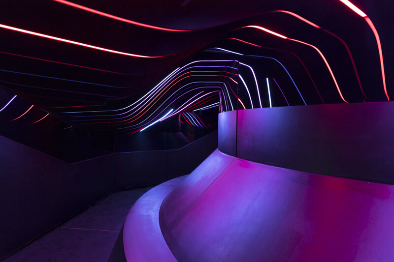 Neon-lit Curved Tunnel