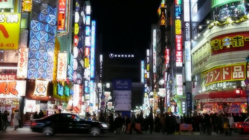 Neon-lit street in Tokyo at night