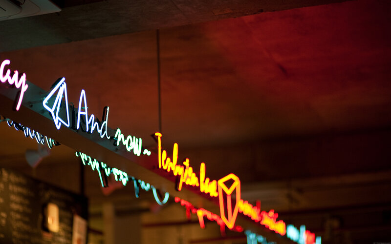 Neon sign in a dimly lit space
