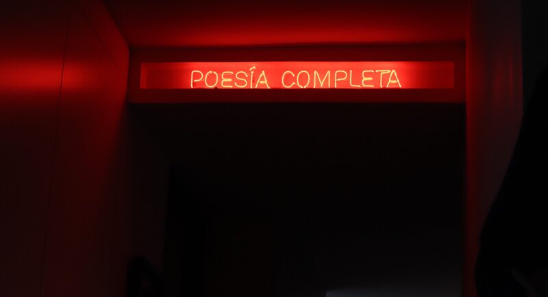 Neon Sign in Hallway
