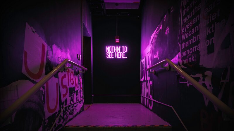 Neon Sign in Stairwell
