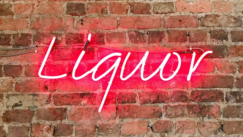 Neon Sign on Brick Wall — Red, Vibrant