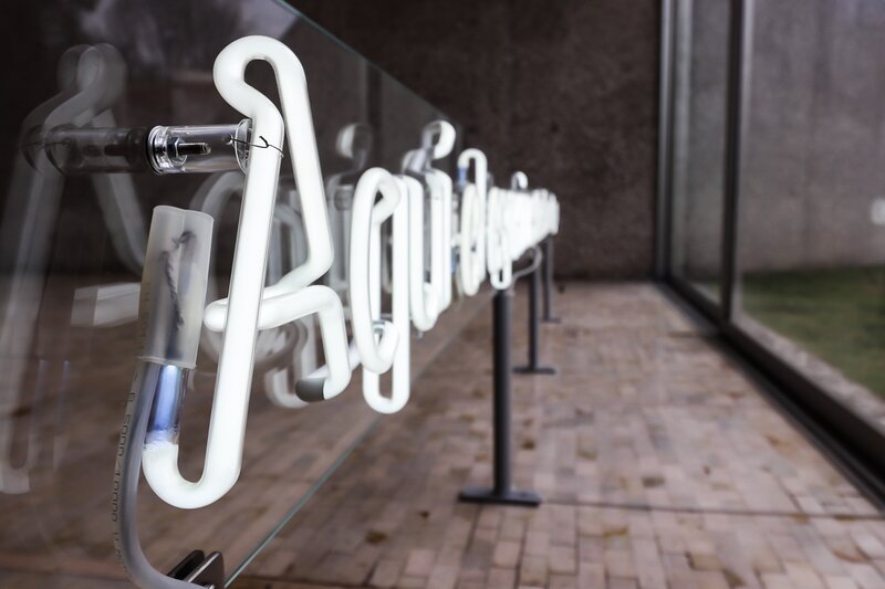 Neon Sign on Glass Wall