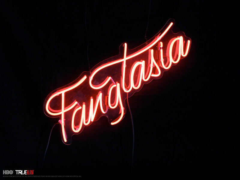 Neon Sign Reading 'Fantasia' — Red