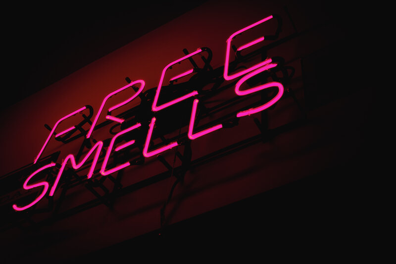 neon sign reading free smells