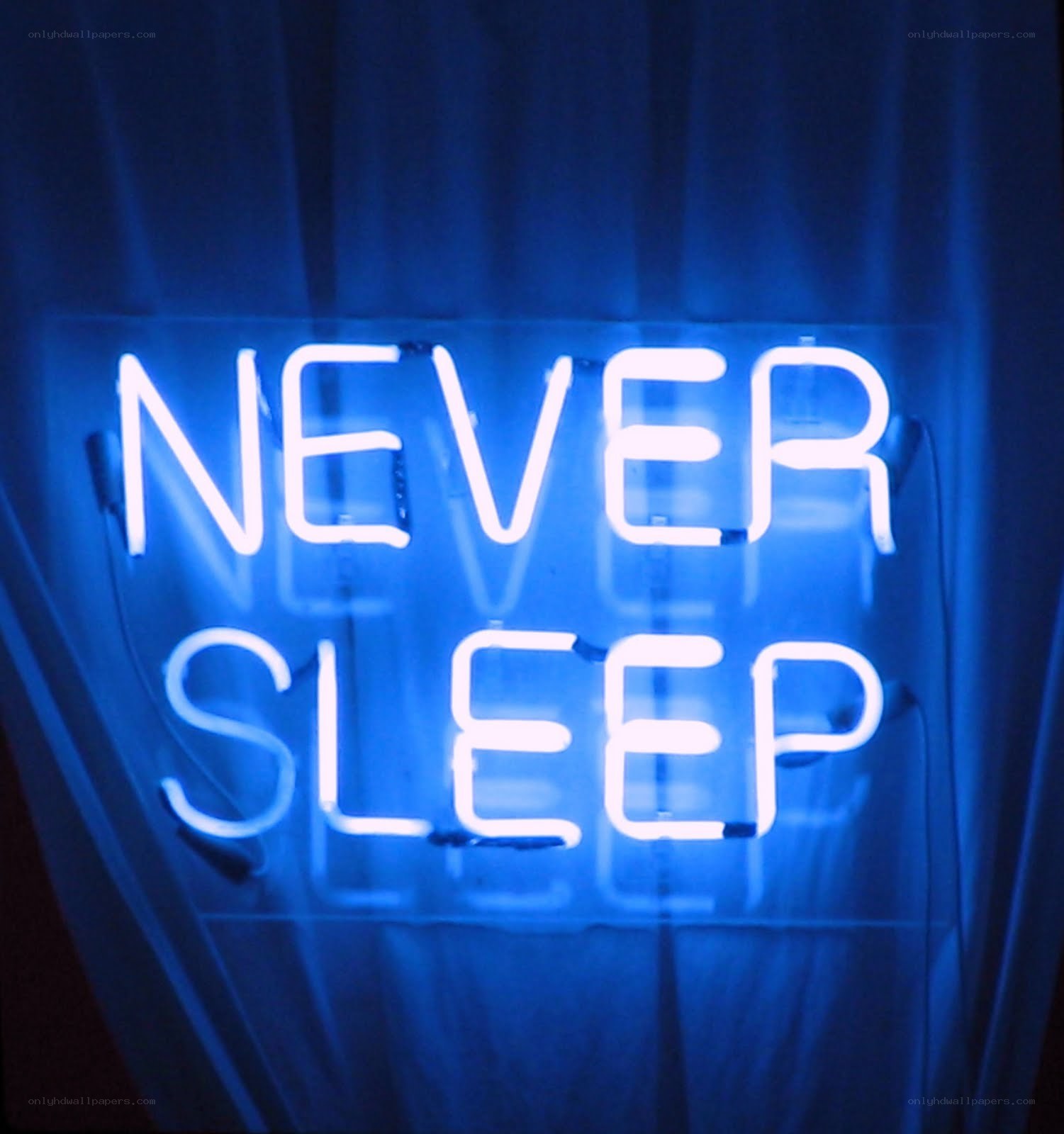 Neon sign reading NEVER SLEEP