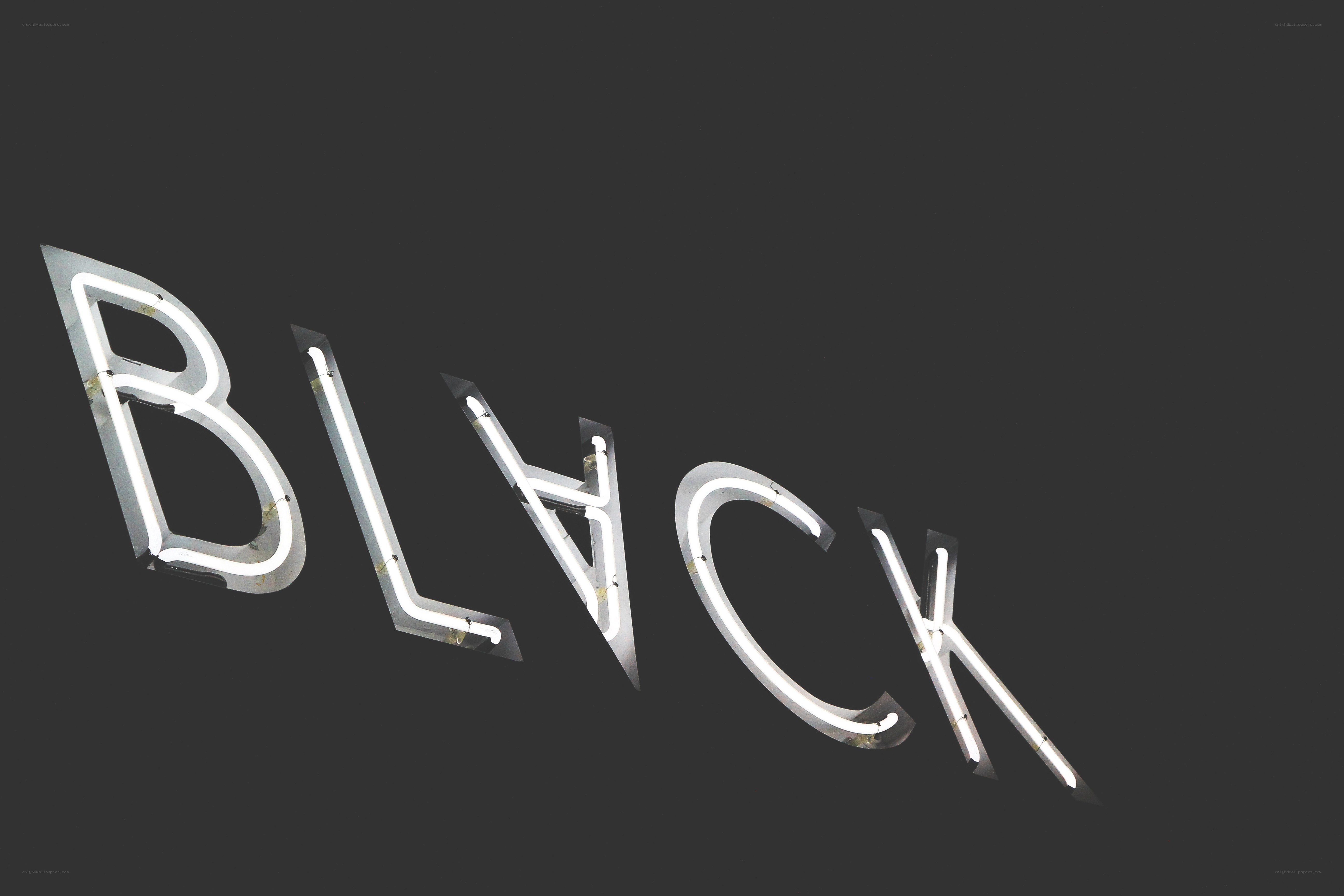 Neon sign spelling BLACK