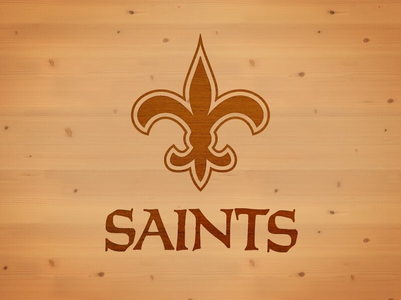 New Orleans Saints logo on wood