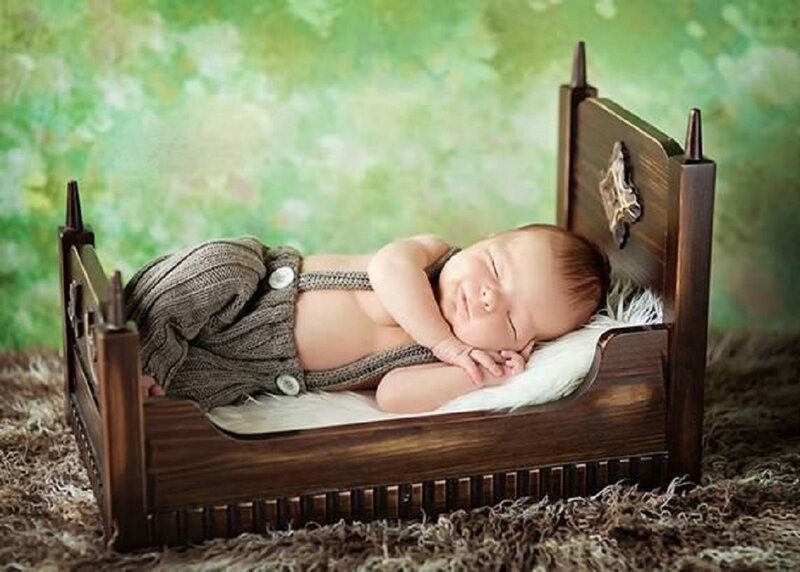 Newborn Baby in Bed — Brown