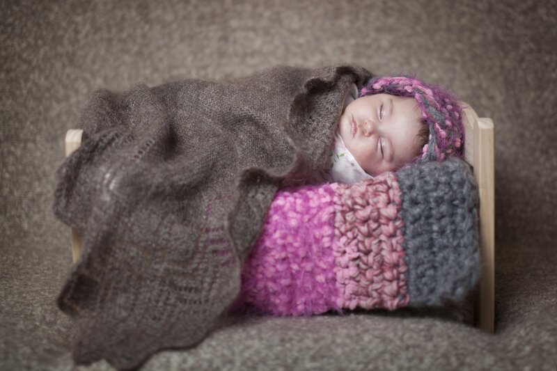 Newborn Baby in Bed — Gray