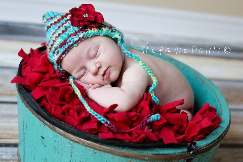 Newborn Baby in Bucket — Red, Serene