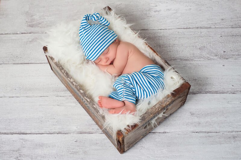 Newborn Baby in Crate