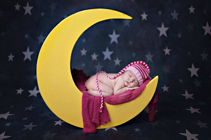 Newborn Baby in Crescent Moon