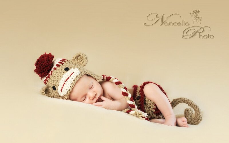 Newborn Baby in Monkey Hat
