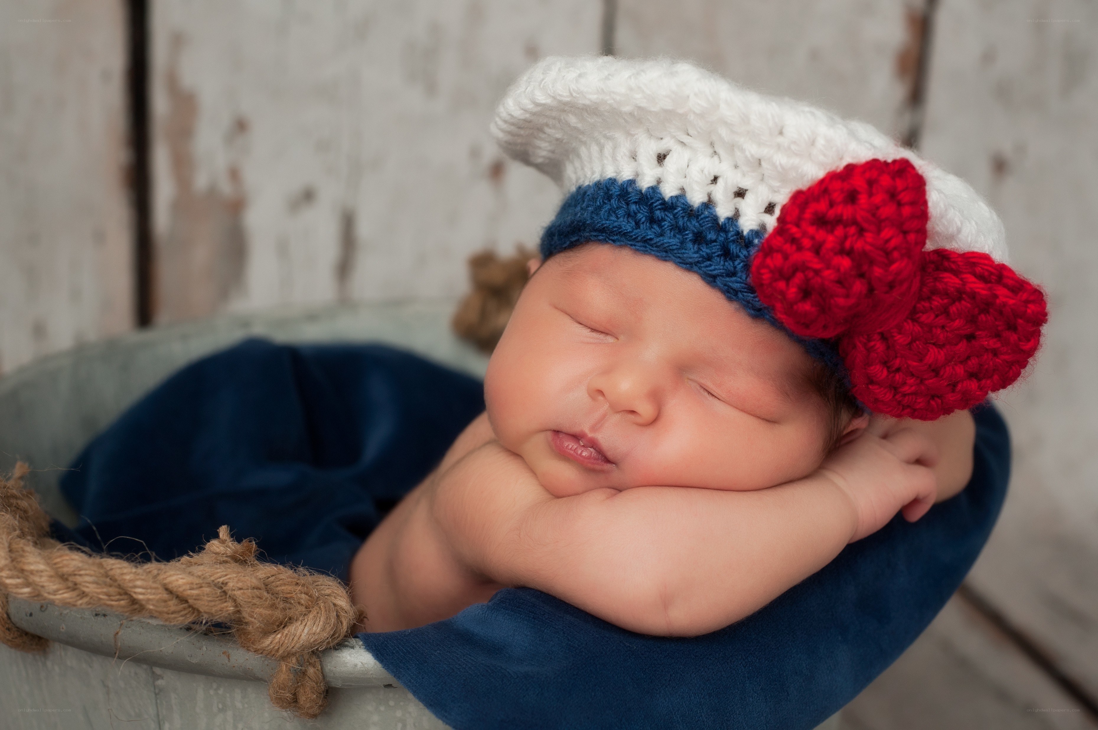 Newborn baby in sailor hat