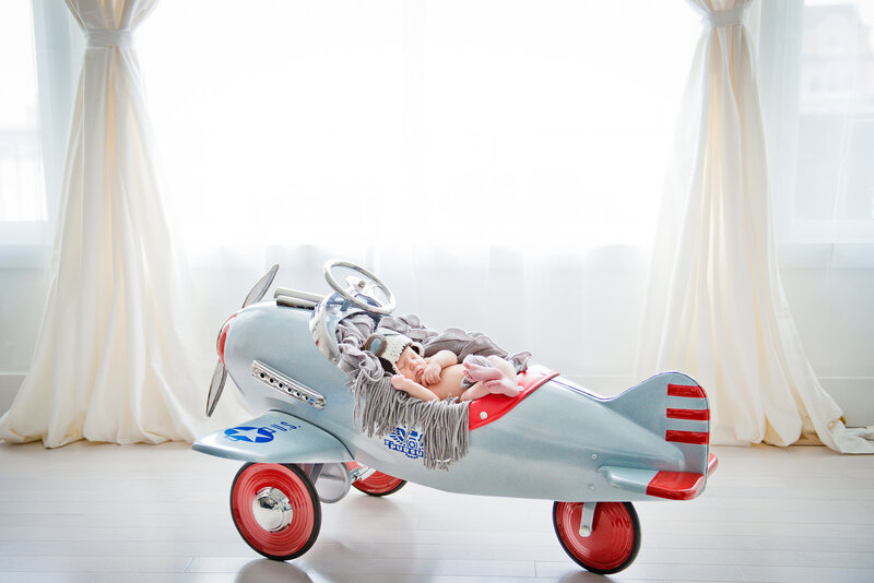 Newborn Baby in Toy Plane