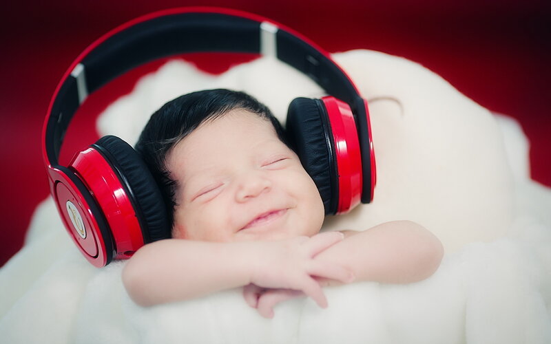 Newborn Baby with Headphones — Red