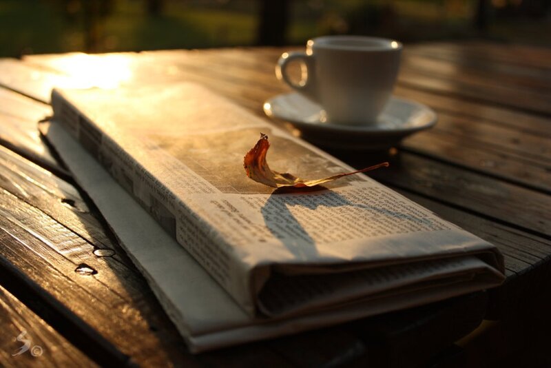 Newspaper and Coffee Cup