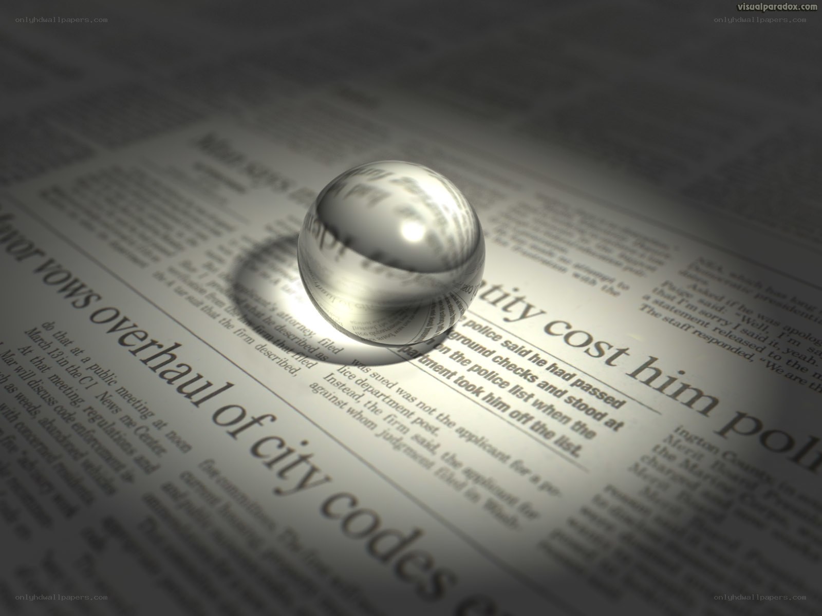 newspaper with glass ball