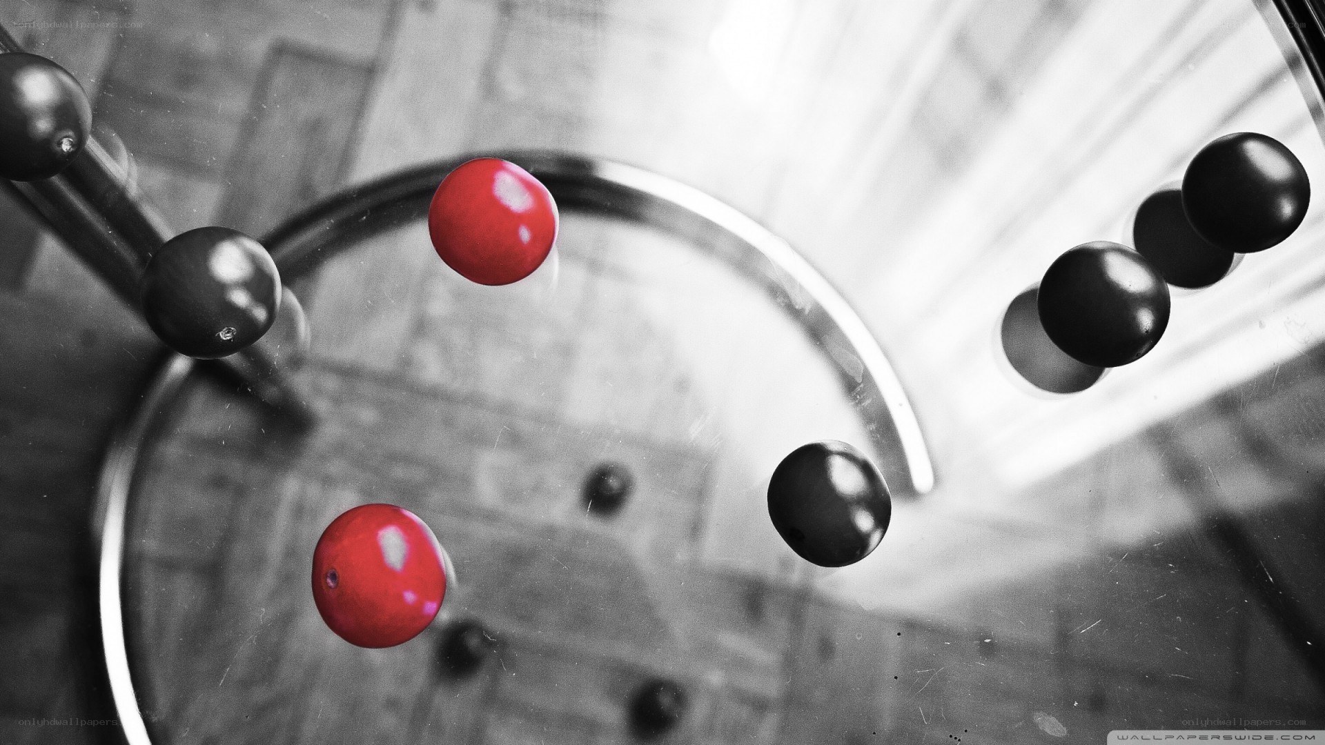 Newton's cradle with red balls
