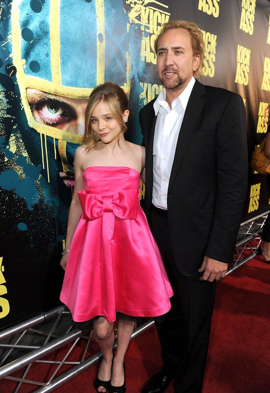 Nicolas Cage and a young girl at a movie premiere