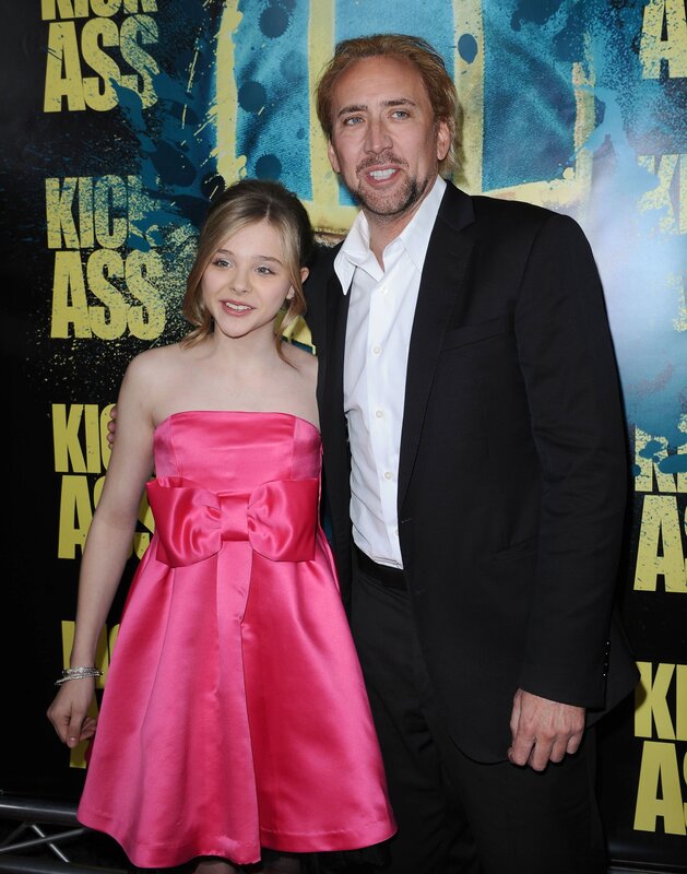 Nicolas Cage with young girl at premiere