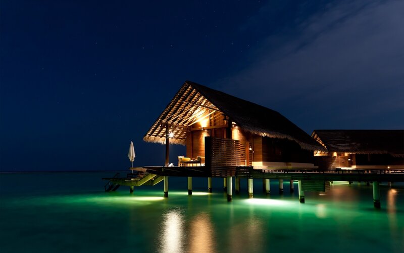 Night at a tropical overwater bungalow