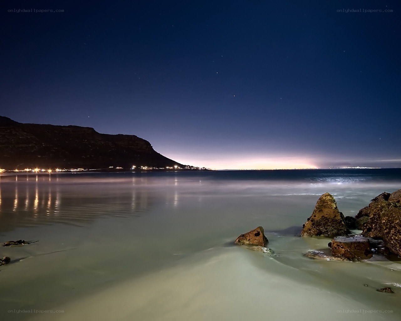 Night at the beach with mountain view